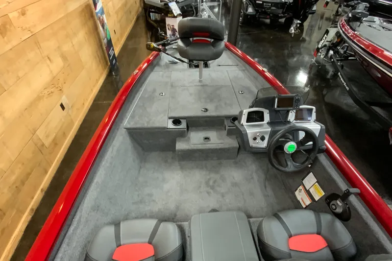 Slide: The Image of 2025 Tracker Pro Team 175 boat interior with steering console and seating. - 4