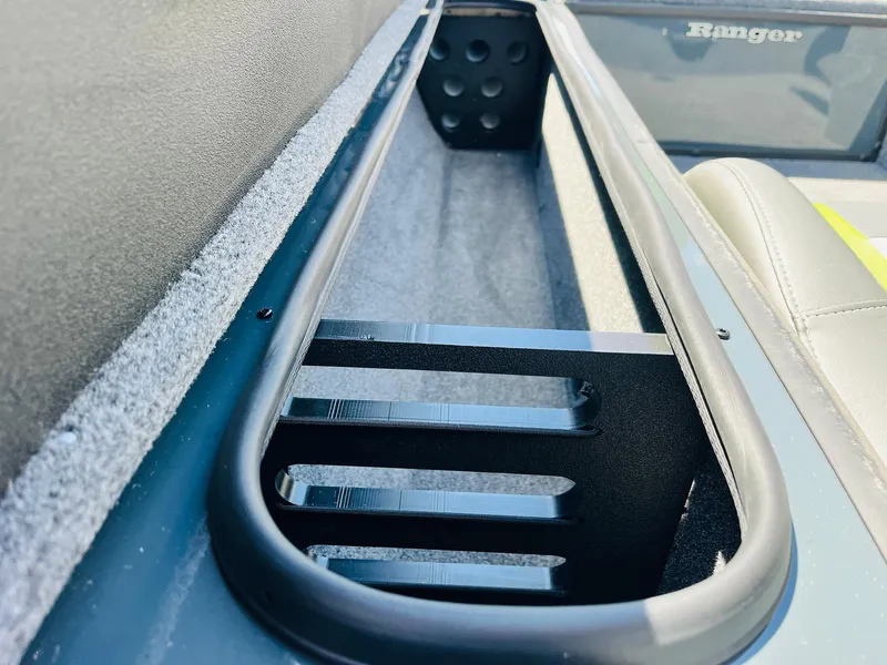 Slide: The Image of 2025 Ranger RT188C boat interior storage compartment with sleek design and durable materials. - 33