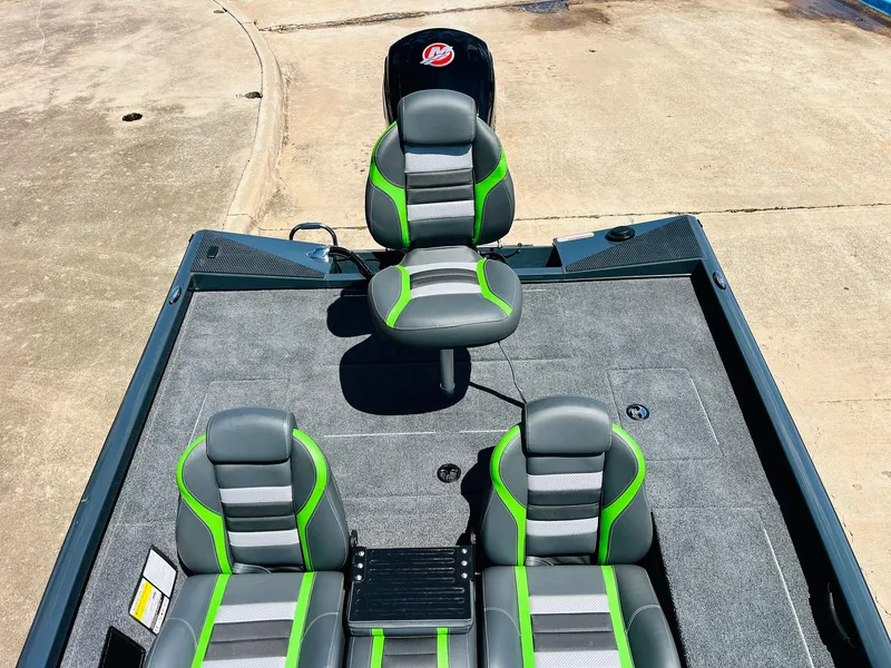 Slide: The Image of 2025 Ranger RT188C boat interior with gray and green seating, spacious deck. - 45