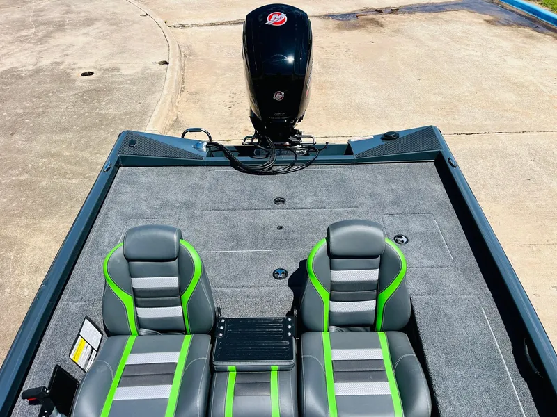 Slide: The Image of 2025 Ranger RT188C boat interior with dual seats and outboard motor. - 47