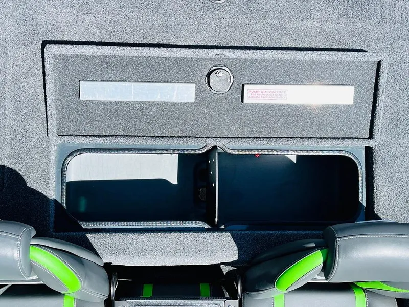Slide: The Image of 2025 Ranger RT188C boat storage compartment with green-accented seats. - 48