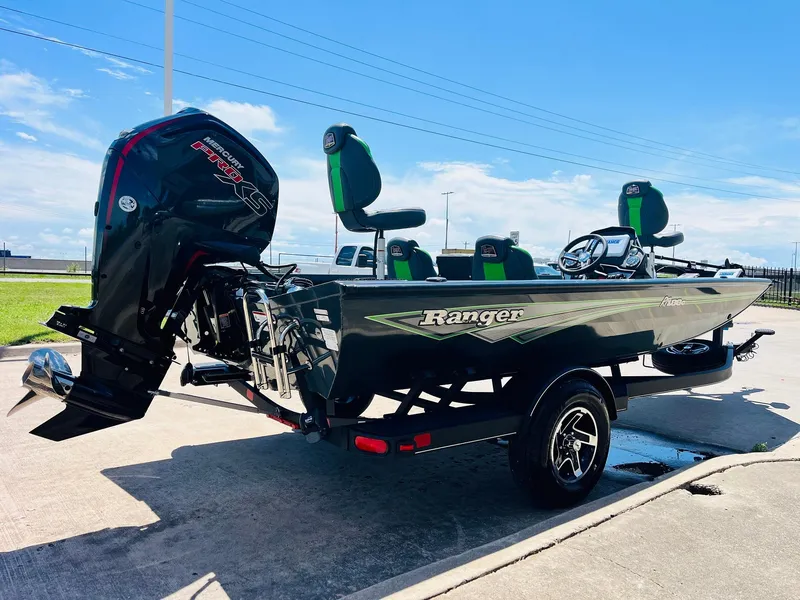 Slide: The Image of 2025 Ranger RT188C boat with motor, parked on a sunny day. - 7