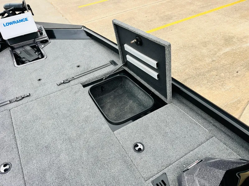 Slide: The Image of 2024 Ranger RT198P boat deck with open storage compartment and Lowrance equipment. - 16