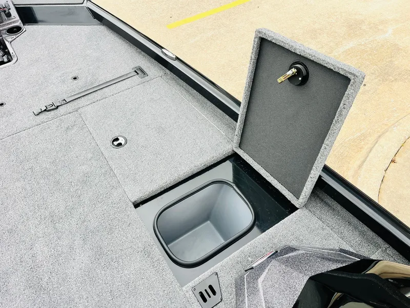 Slide: The Image of 2024 Ranger RT198P boat storage compartment with open lid, showcasing interior space. - 18