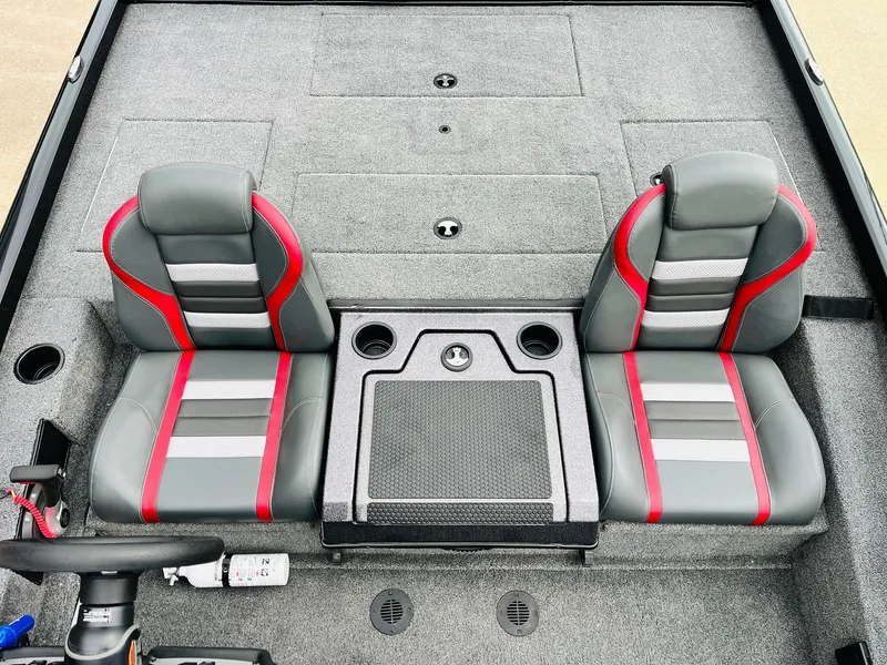 Slide: The Image of 2024 Ranger RT198P boat interior with dual gray and red seats, center console, and cup holders. - 23