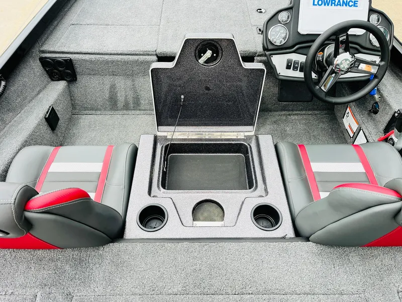 Slide: The Image of 2024 Ranger RT198P boat interior with steering wheel, storage compartment, and seating. - 24