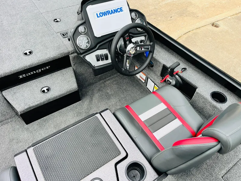 Slide: The Image of 2024 Ranger RT198P boat interior with Lowrance display and stylish seating. - 26