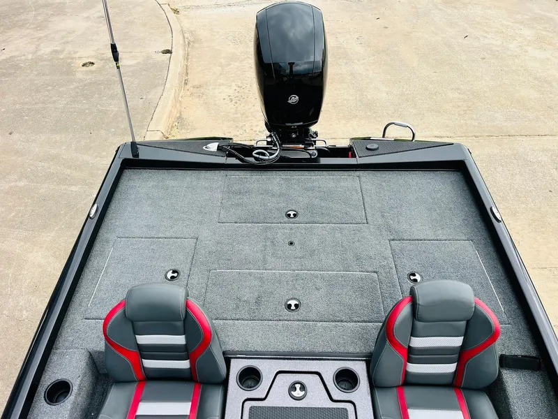 Slide: The Image of 2024 Ranger RT198P boat interior with dual seats and motor, viewed from above. - 28
