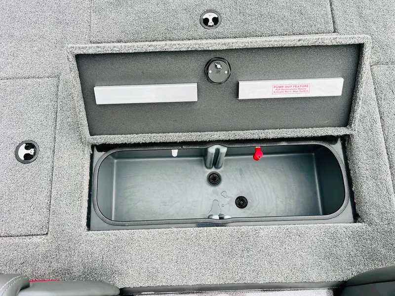 Slide: The Image of 2024 Ranger RT198P boat storage compartment with open lid, showcasing interior space. - 30