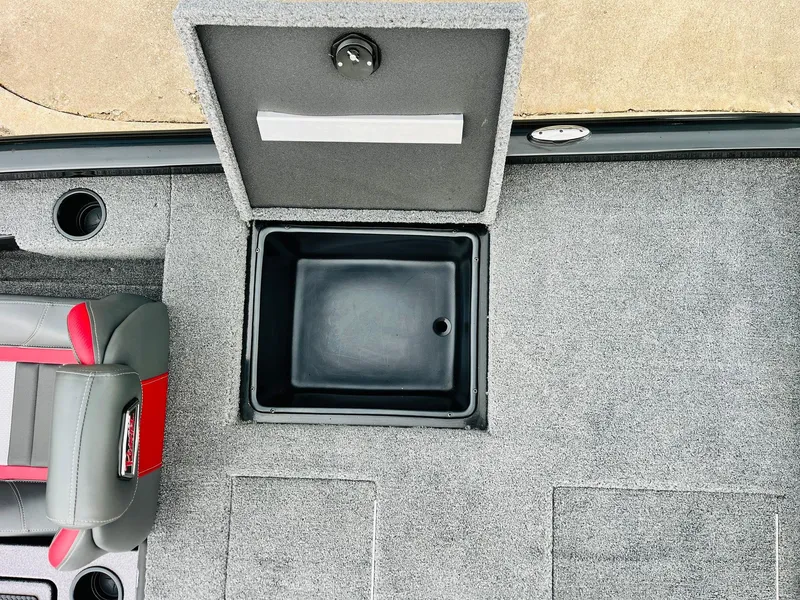 Slide: The Image of 2024 Ranger RT198P boat interior with open storage compartment and seating. - 36