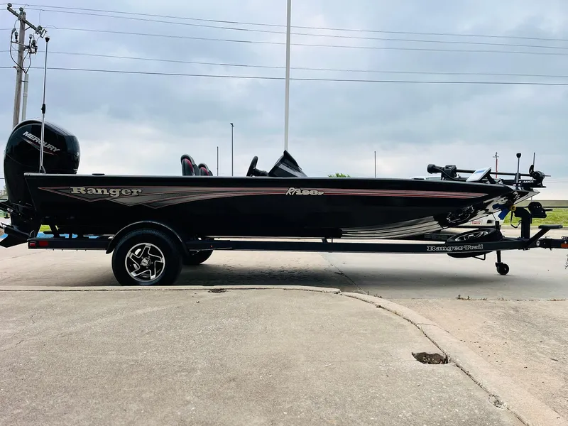 Slide: The Image of 2024 Ranger RT198P boat on trailer, side view, outdoors. - 4