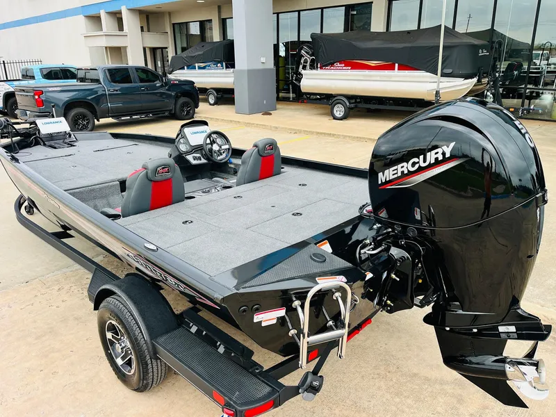 Slide: The Image of 2024 Ranger RT198P boat with Mercury engine, parked outdoors. - 7