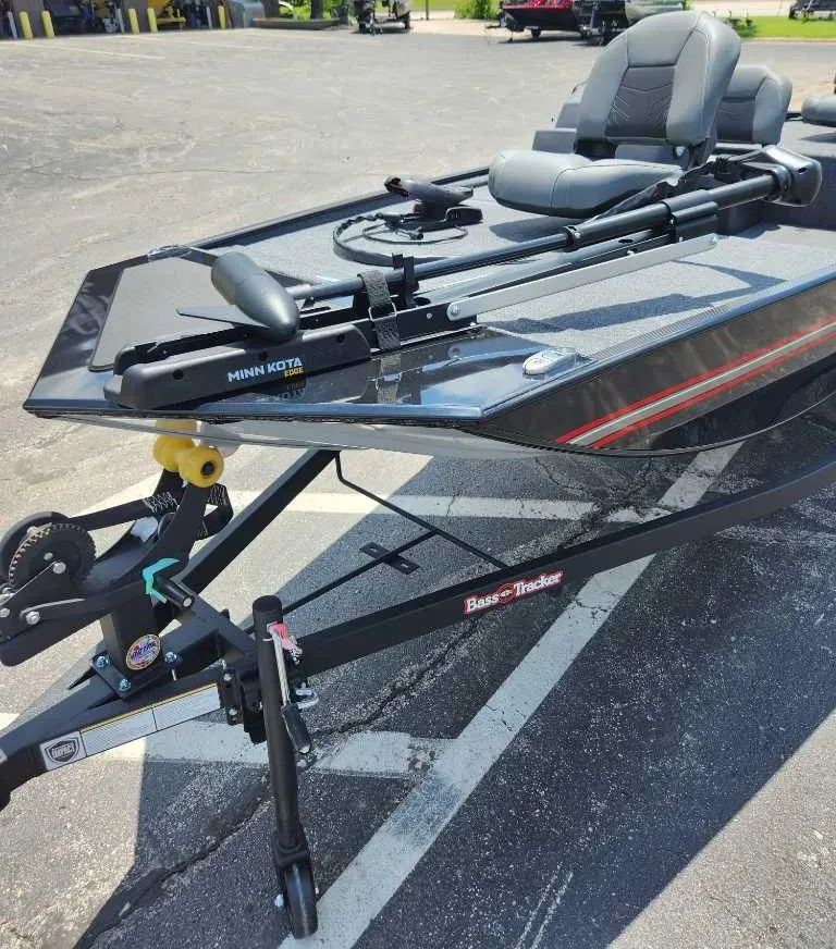 Slide: The Image of 2025 Tracker Bass Tracker Classic XL boat on trailer, featuring Minn Kota trolling motor. - 2