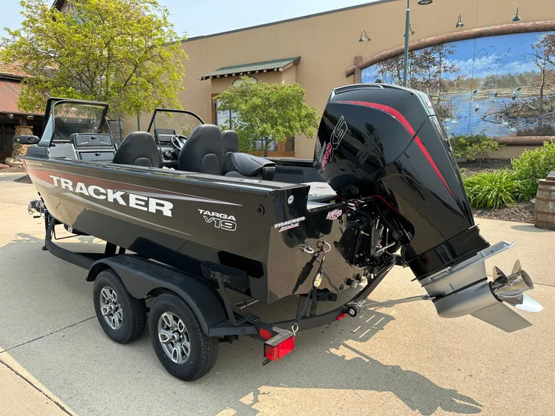Slide: The Image of 2025 Tracker Targa V-19 Combo boat on trailer, outdoor setting. - 2