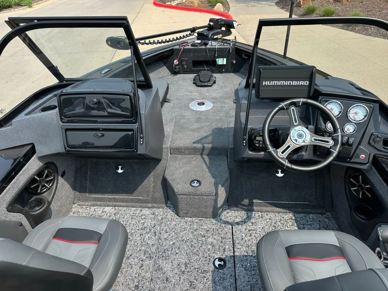 Slide: The Image of 2025 Tracker Targa V-19 Combo boat interior with steering wheel and seating. - 6