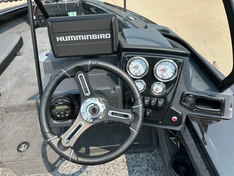Slide: The Image of 2025 Tracker Targa V-19 Combo dashboard with steering wheel and Humminbird fish finder. - 8