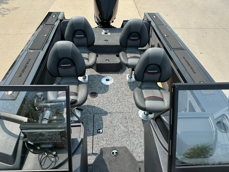 Slide: The Image of 2025 Tracker Targa V-19 Combo boat interior with four seats and modern design. - 9