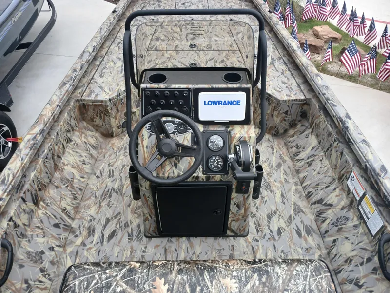 Slide: The Image of 2025 Ranger RB200 boat interior with camouflage design and Lowrance navigation system. - 2
