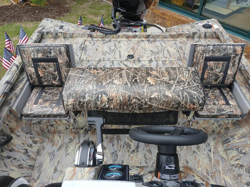 Slide: The Image of 2025 Ranger RB200 boat interior with camouflage design and steering console. - 3