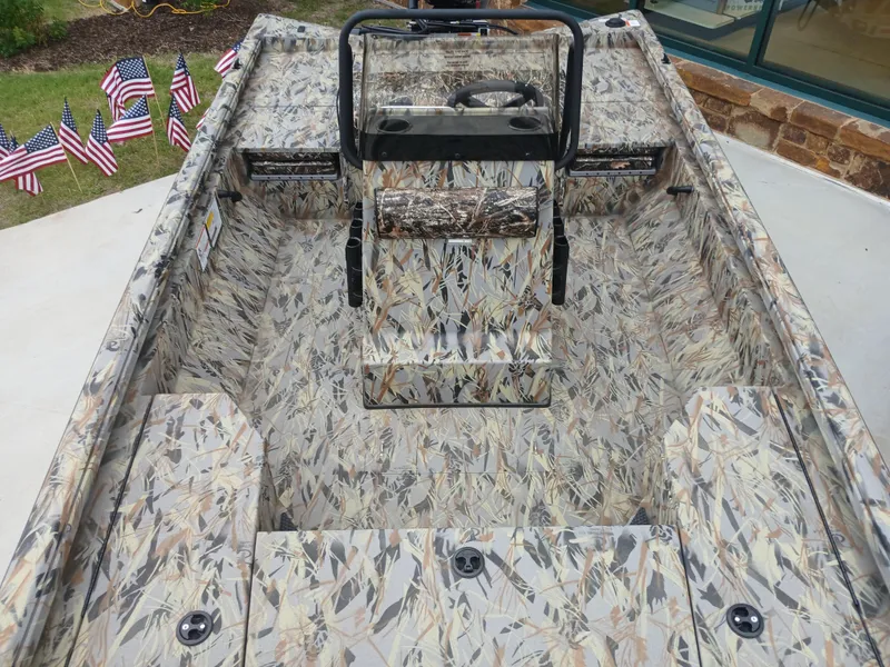 Slide: The Image of 2025 Ranger RB200 boat with camouflage interior, surrounded by American flags. - 5