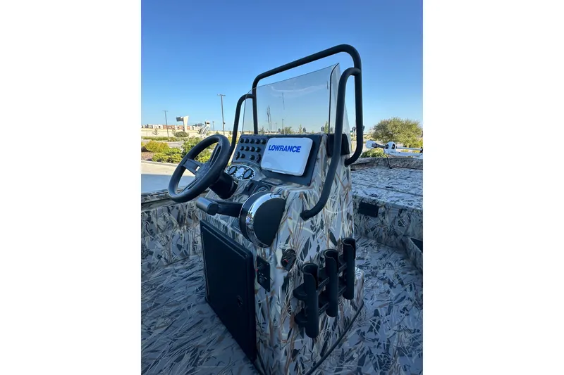 Slide: The Image of 2025 Ranger RB200 boat console with steering wheel and Lowrance display. - 85