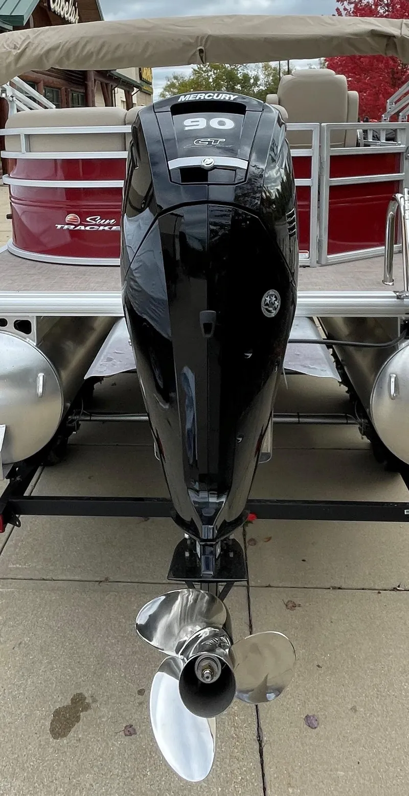 Slide: The Image of 2025 Sun Tracker Party Barge 20 DLX with powerful outboard motor. - 4