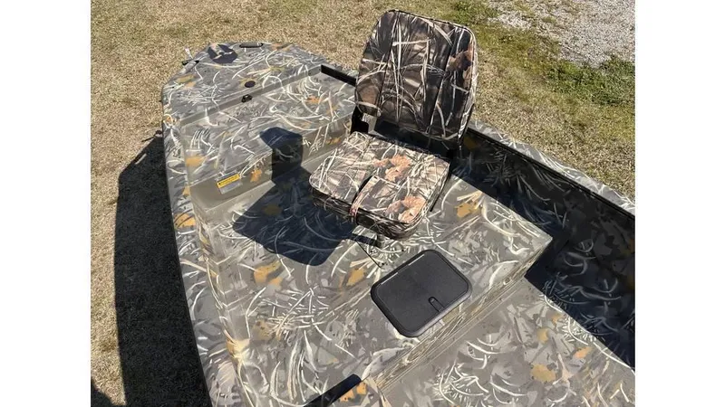 Slide: The Image of 2025 War Eagle 750 Gladiator boat with camouflage seating and deck, ideal for outdoor adventures. - 3
