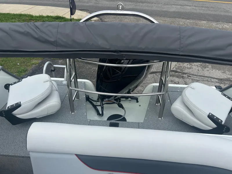 Slide: The Image of 2025 Lowe Deck SD224 boat interior with seating and railing. - 4