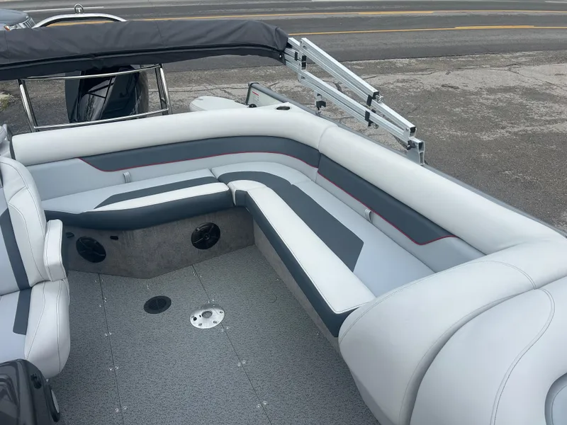 Slide: The Image of 2025 Lowe Deck SD224 boat interior with gray and white seating, modern design. - 8
