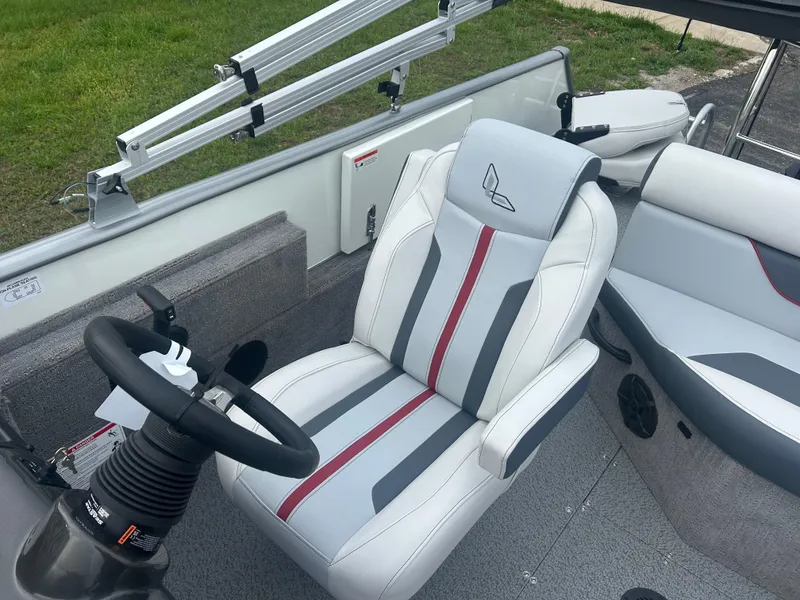 Slide: The Image of 2025 Lowe Deck SD224 boat interior with stylish seating and steering wheel. - 9