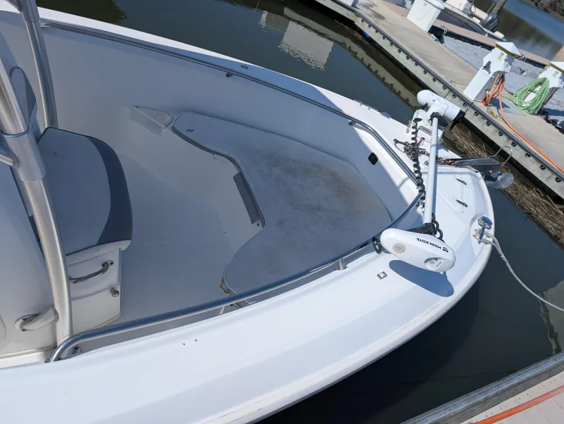 Slide: The Image of 2008 Boston Whaler 24 Outrage boat docked, featuring spacious deck and modern equipment. - 13