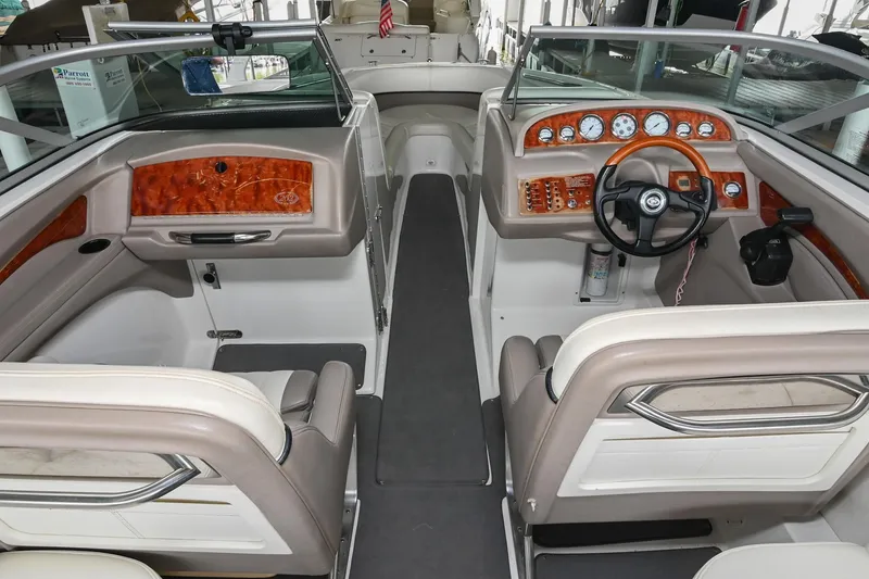 Slide: The Image of 2005 Cobalt 262 boat interior with wood accents and dual seating. - 20