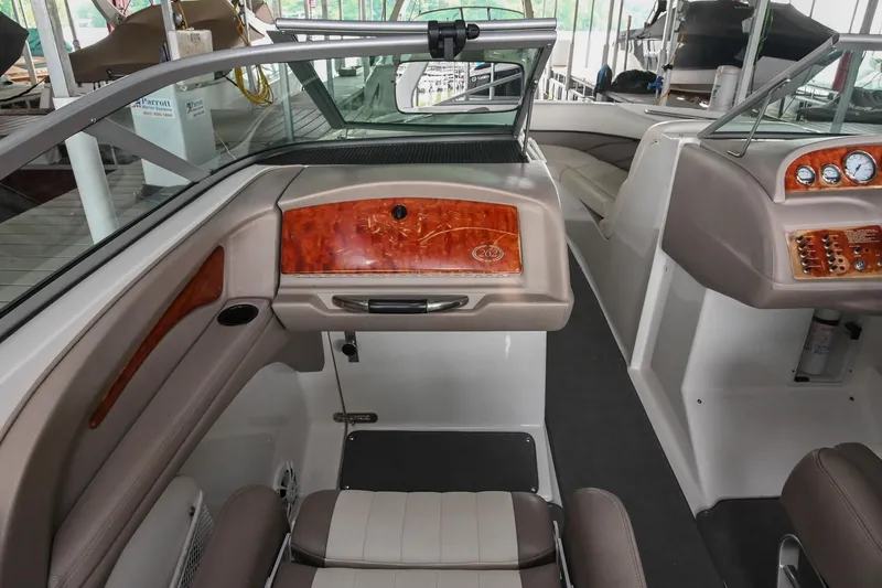 Slide: The Image of Interior of a 2005 Cobalt 262 boat, featuring sleek seating and wood accents. - 22
