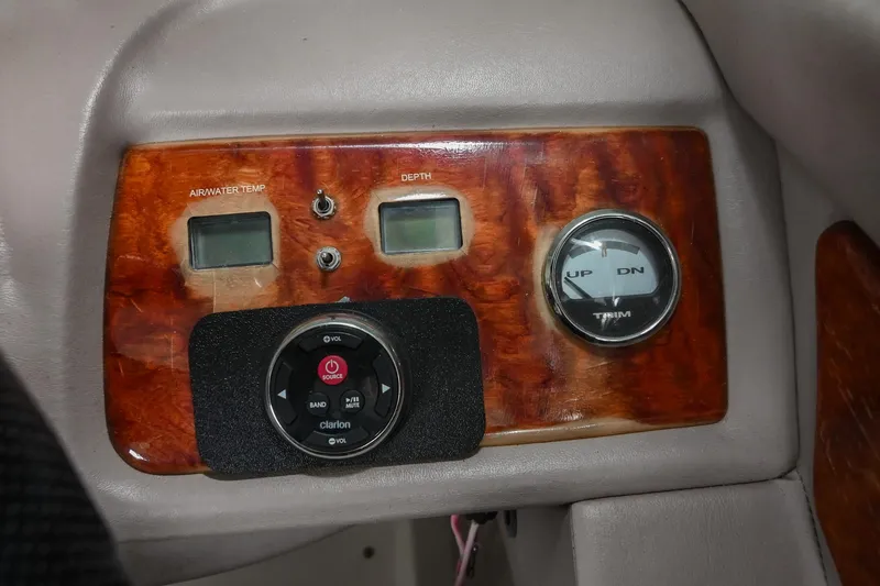 Slide: The Image of Control panel of a 2005 Cobalt 262 boat with wood finish and gauges. - 29