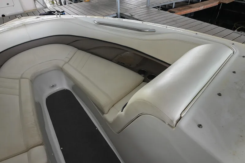 Slide: The Image of 2005 Cobalt 262 boat interior with white leather seating and sleek design. - 35