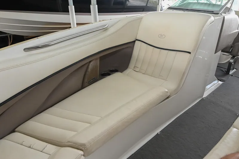 Slide: The Image of 2005 Cobalt 262 boat interior with beige seating and sleek design. - 36