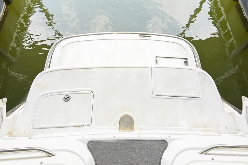 Slide: The Image of 2005 Cobalt 262 boat stern view with swim platform and storage compartments. - 7