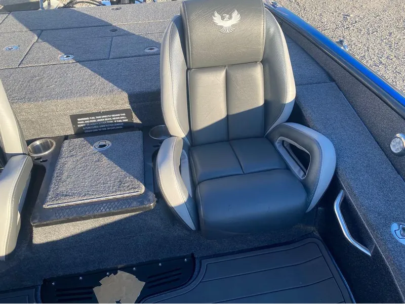 Slide: The Image of 2025 Phoenix 920 Elite boat interior with cushioned seating and storage compartments. - 4