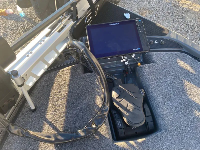 Slide: The Image of 2025 Phoenix 920 Elite boat console with Lowrance display and foot pedal controls. - 6