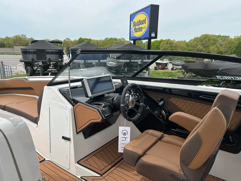Slide: The Image of 2025 Yamaha Boats 252SE interior with modern dashboard and luxurious seating. - 7
