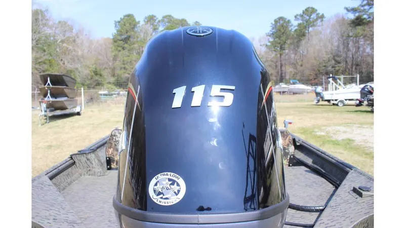 Slide: The Image of 2025 War Eagle 860LDSV Sportsman boat with 115 horsepower engine, outdoors. - 2