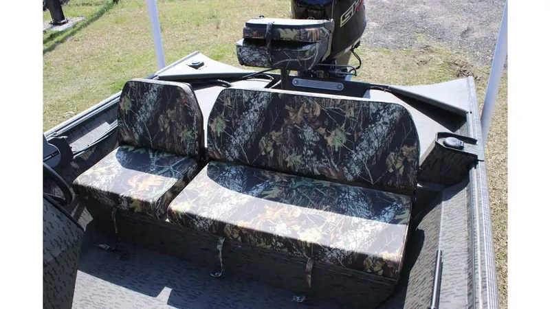 Slide: The Image of 2025 War Eagle 860LDSV Sportsman boat with camouflage seating and motor, outdoors. - 5