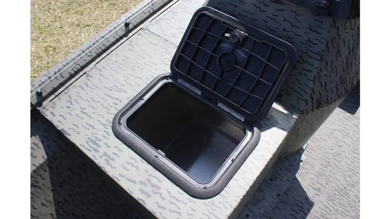 Slide: The Image of Open storage compartment on 2025 War Eagle 860LDSV Sportsman boat. - 6