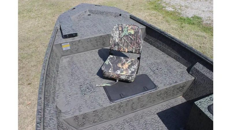 Slide: The Image of 2025 War Eagle 860LDSV Sportsman boat with camo seat on textured deck. - 8
