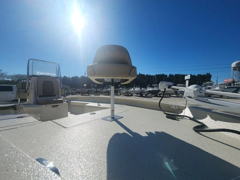 Slide: The Image of 2025 Xpress H22B boat deck under clear blue sky, featuring seating and equipment. - 12