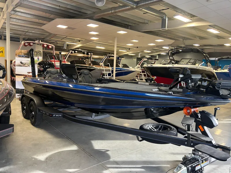 Slide: The Image of 2025 Skeeter ZXR20 boat displayed in a showroom, featuring sleek design and modern amenities. - 2