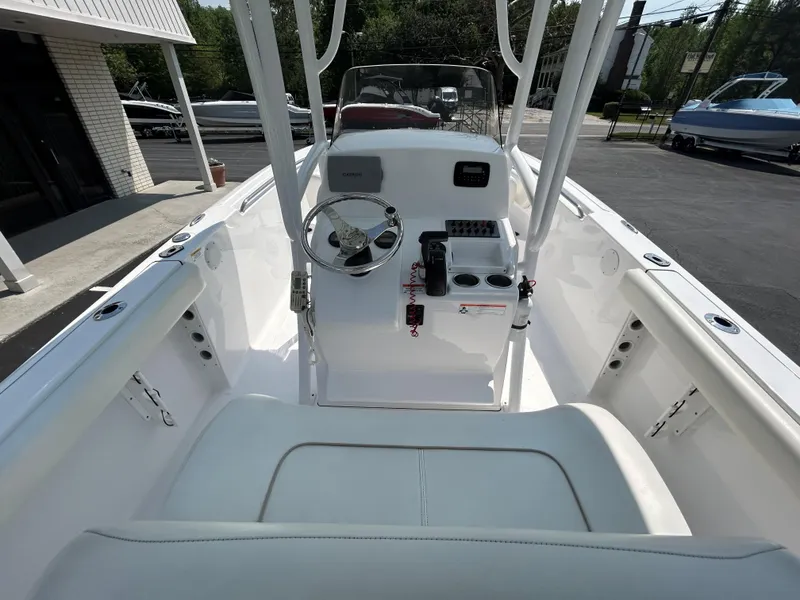 Slide: The Image of 2013 Sportsman 229 Heritage boat interior with steering console and seating. - 10