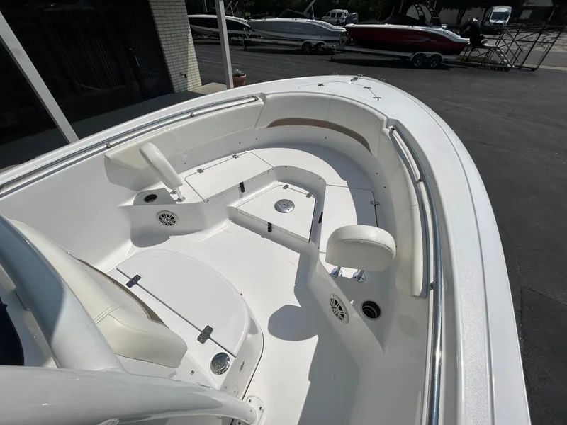 Slide: The Image of 2013 Sportsman 229 Heritage boat interior with seating and storage compartments. - 12