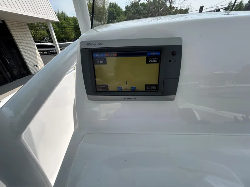 Slide: The Image of 2013 Sportsman 229 Heritage boat with Garmin GPS display. - 13
