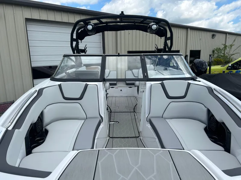 Slide: The Image of 2025 Yamaha Boats 252XE interior with sleek seating and modern design. - 6